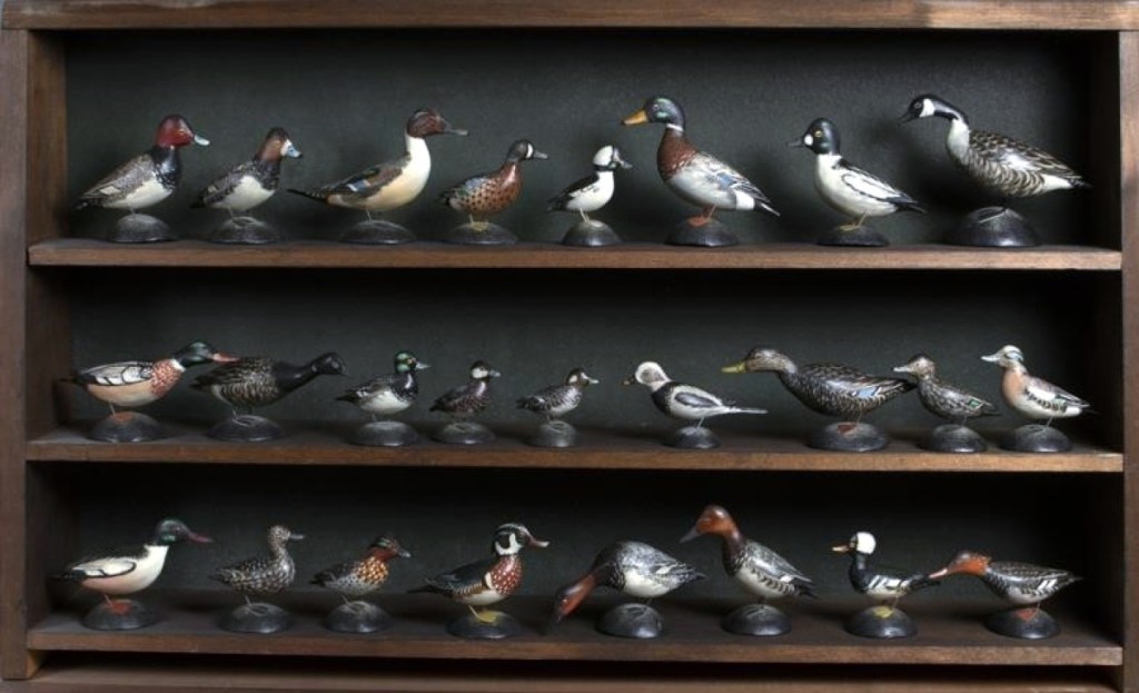 Set of 25 miniature waterfowl by A. Elmer Crowell (1862-1952), East Harwich, Mass., circa 1915, $114,000 ($60/90,000). Very few complete original sets of Crowell miniatures survive. Cape Cod author and Crowell friend Joseph Crosby Lincoln (1870-1944) owned this set. Private Connecticut collection.