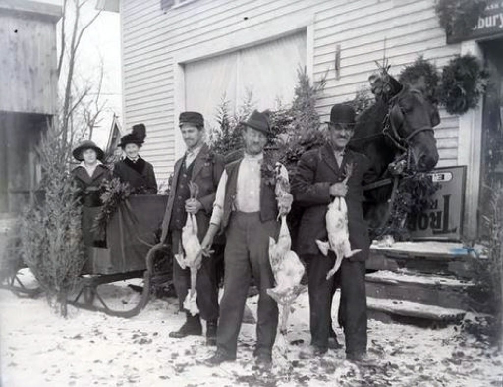 A Nathan Wales photo outside of a store in Franklin features everything one would need for Christmas: trees, wreaths, a goose and a thin sheet of snow. This negative now resides with the Franklin Historical Commission.                      —Coyle’s Auction photo