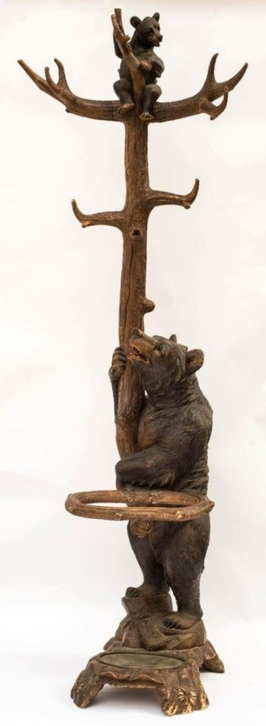 A total of $7,500, the highest price of the day, was paid for this Black Forest hat rack or coat rack. It was nearly 7 feet tall and showed a mother bear trying to coax a cub down from the top.