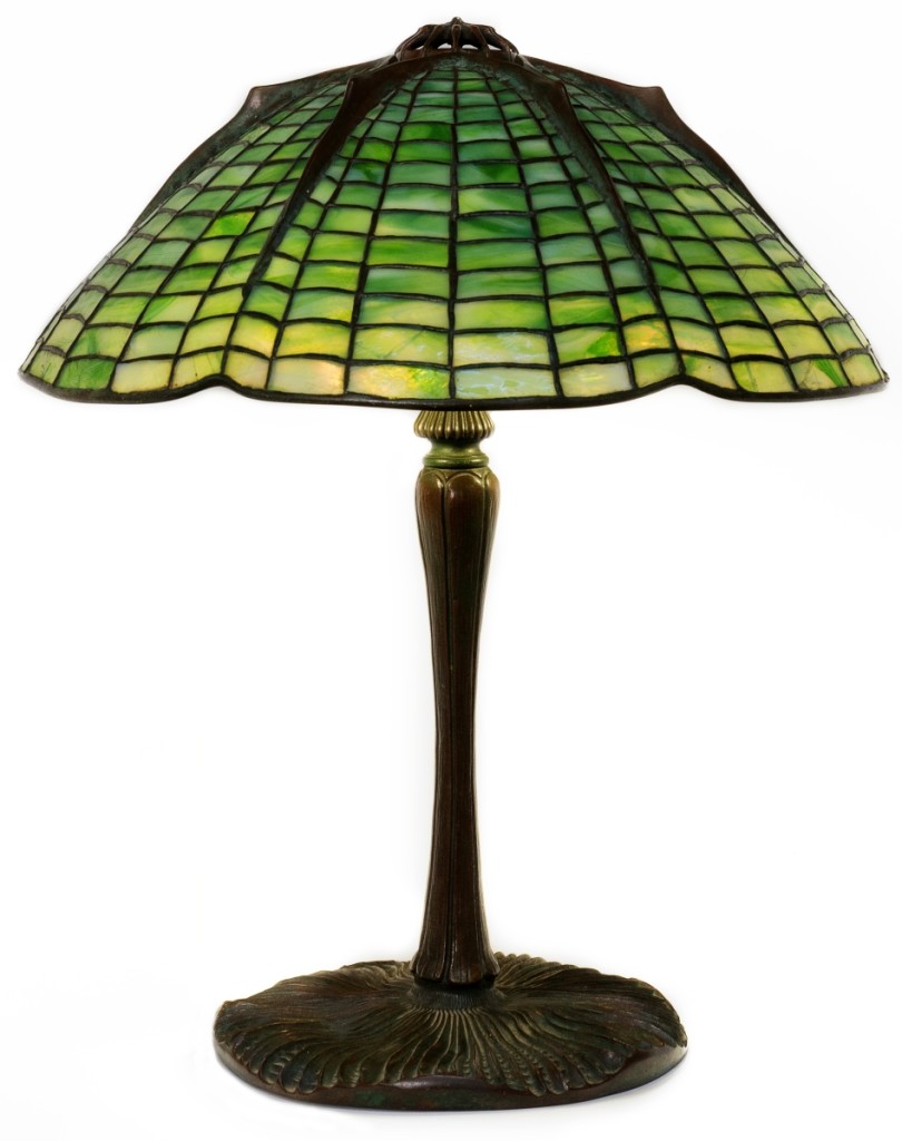 This Tiffany Studios New York, “Spider” table lamp, circa 1900-15, brought $48,000. It stood 15 inches high on a mushroom base and had an 18½-inch diameter shade.