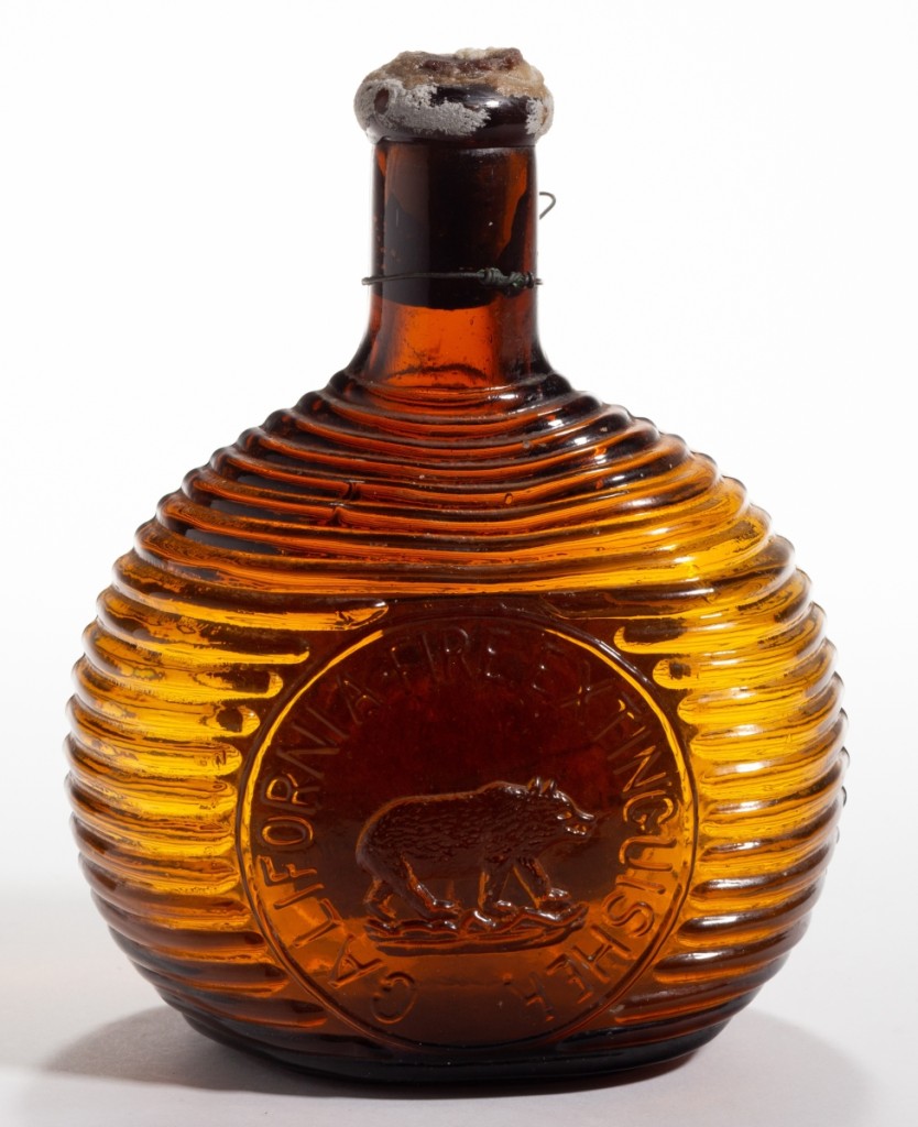 This California pictorial fire grenade tied for the top of the Evitt bottle collection, selling at $16,380. In a medium amber color, it featured its original contents, cork, hanging wire and label to the back. The auction house found only one other record of this bottle and Evans’ result sold for twice the previous amount, making it the record.