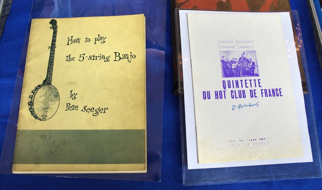 American folk musician and songwriter Pete Seeger was known to sign just about anything that was put in front of him. At Riverrow Bookshop, Owego, N.Y., his instructional book on mastering the five-string banjo adds a humorous “Best of Luck.” To the right is a signed program by the “King of Hot Gypsy Jazz” Django Reinhardt and Stephane Grappelly [sic], which in 1937 was priced at 8 francs — today’s asking price: $3,000.