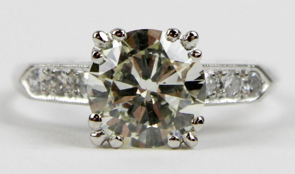 A 1.82-carat solitaire diamond and platinum ring brought $5,100. The stone was SI2 color O with three small round cut diamonds down each side.