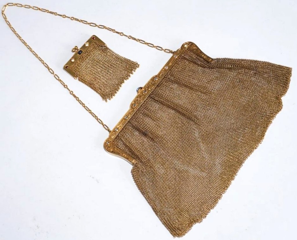 A set of two mesh purses with 14K gold clasps, circa 1900, set with diamonds and sapphires, sold at $5,280.