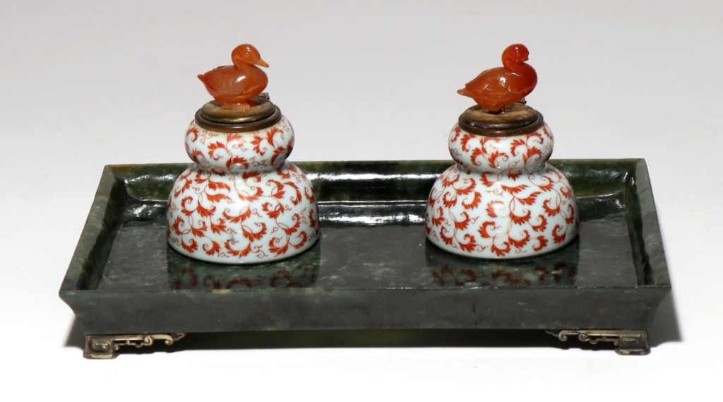 Bringing the top price in the sale was this carved spinach jade and porcelain standish with porcelain inkwells with carved agate bird finials; it attracted 35 bids and closed at $41,480 ($500/700).