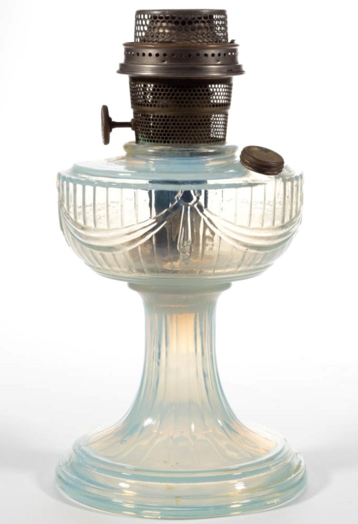 The top lot in the sale was this clear opalique Aladdin short Lincoln drape stand lamp that made $14,040 ($1/1,500).