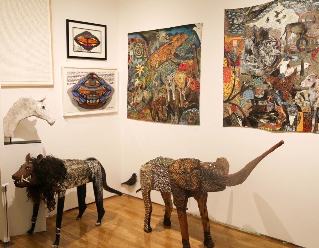 Works from Ionel Talpazan and O.L. Samuels are seen in American Primitive’s booth from the 2017 Outsider Art Fair.