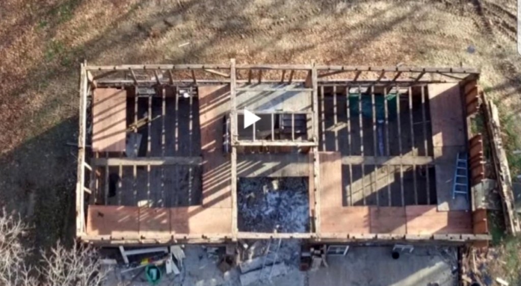 Screen shot from a video showing a bird’s-eye view of the second floor of the house   during deconstruction.