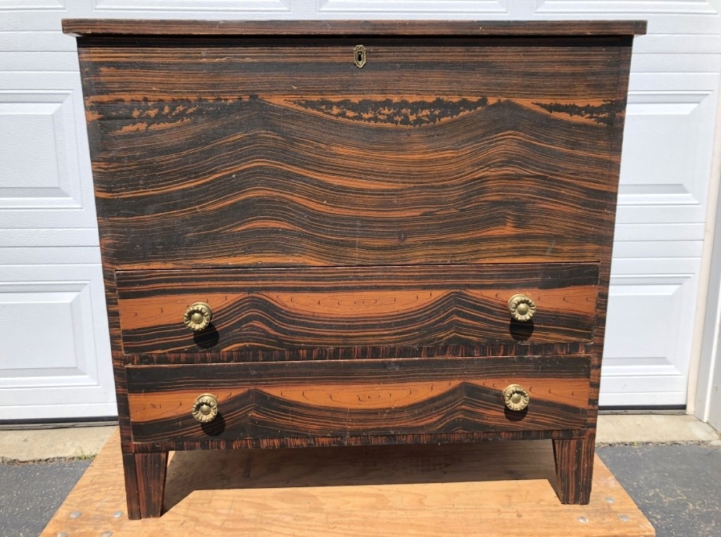 Christopher Settle, Newton, Mass., sold a New England Hepplewhite grain-painted two-drawer blanket chest, circa 1800.