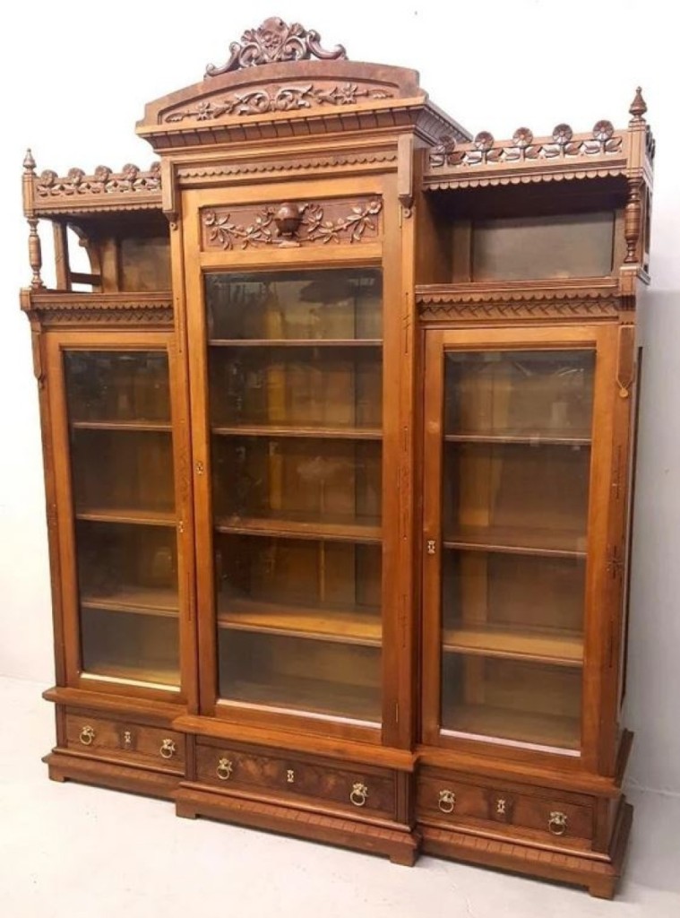 Jay Anderson sold this bookcase three decades ago, and it reprised itself in the March sale with a $6,324 result. Eastlake, circa 1880s, three-door curio bookcase in American burl walnut with carved cornice and rosette moulding.