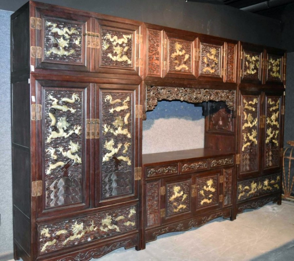 Auctioneer John Nye called this Chinese hardstone inlaid hardwood cabinet a headscratcher as it rose well above the $900 estimate to sell for $20,910, the top lot of the sale. That it was a large piece of furniture did not hurt its appeal, and it sold to a local buyer to the auction house.