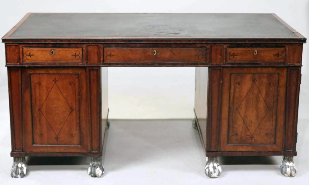 Leading all English furniture in the sale was this Regency inlaid mahogany partners’ desk from the Nineteenth Century with verdigris-decorated paw feet that brought $9,600.
