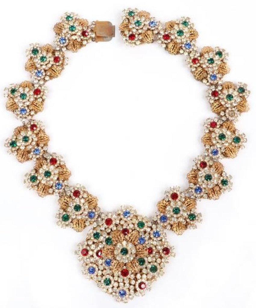The auction’s top lot at $1,625 was a Miriam Haskell gold gilt brass filigree necklace with 14 layered medallion cluster jewel links, decorated with tri-color and colorless diamante crystal jewels.