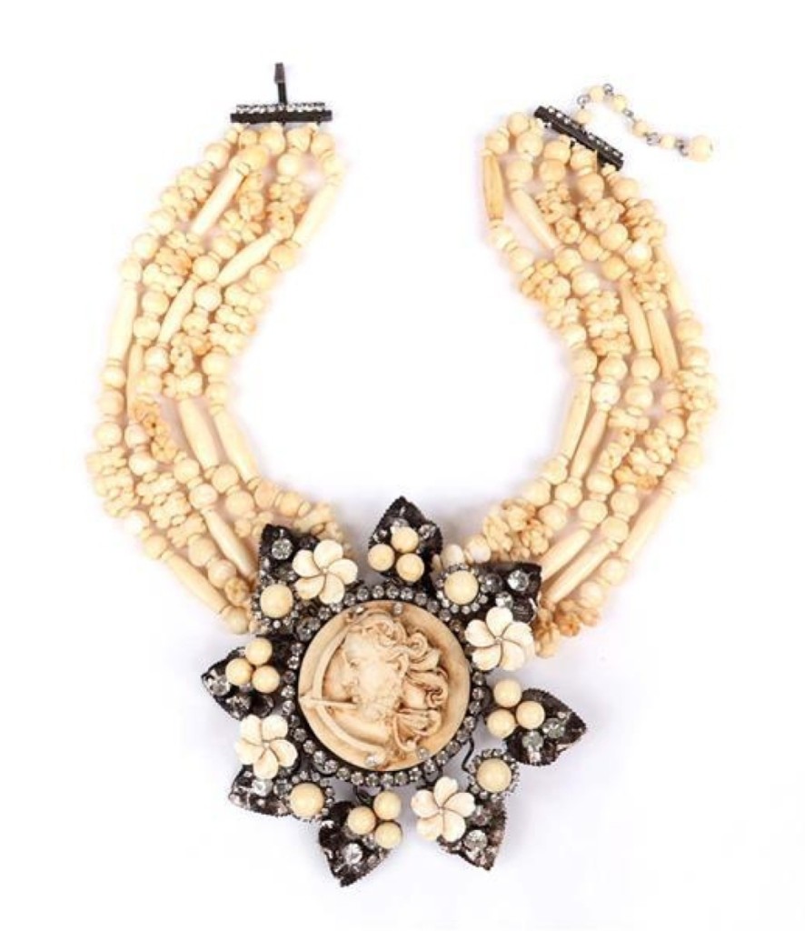 Lawrence Vrba was the head designer at Miriam Haskell in the 1970s. A Vrba “The Archer” five-strand carved bead necklace with medallion pin pendant surrounded by black metal leaves, flowers and rhinestones sold for $1,000.