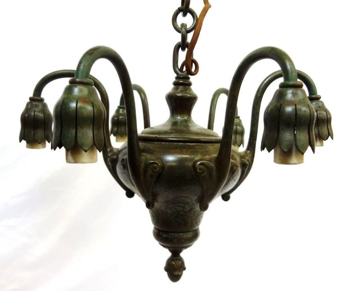 Topping the sale was this bronze six-arm chandelier, which was cataloged as “style” of Tiffany but the private collector who acquired it for $3,867 was “100 percent” it was the real thing; he also had period shades for the acorn-drop light sockets. ($75-150).
