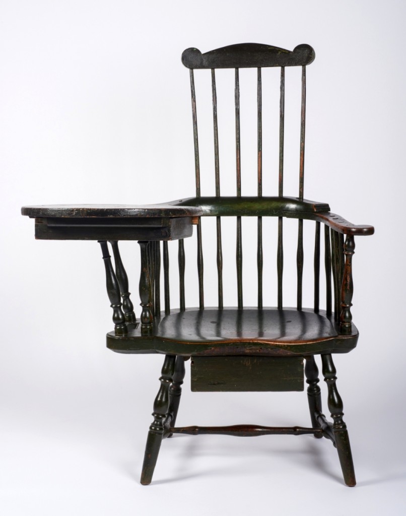 High-back Windsor armchair with writing arm attributed to Ebenezer Tracy Sr, late Eighteenth Century. Wood and green paint, 36-  by 36¼ by 31 inches. Jonathan and Karin Fielding Collection.