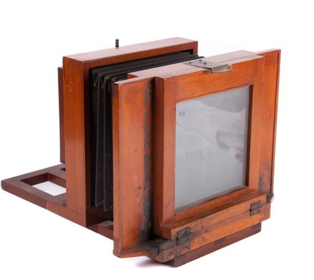 Opfer said that this Simon Wing four-tube camera could take four images at one time. It had an intact bellows and was made of mahogany. The example led the camera category as it sold for $2,091.