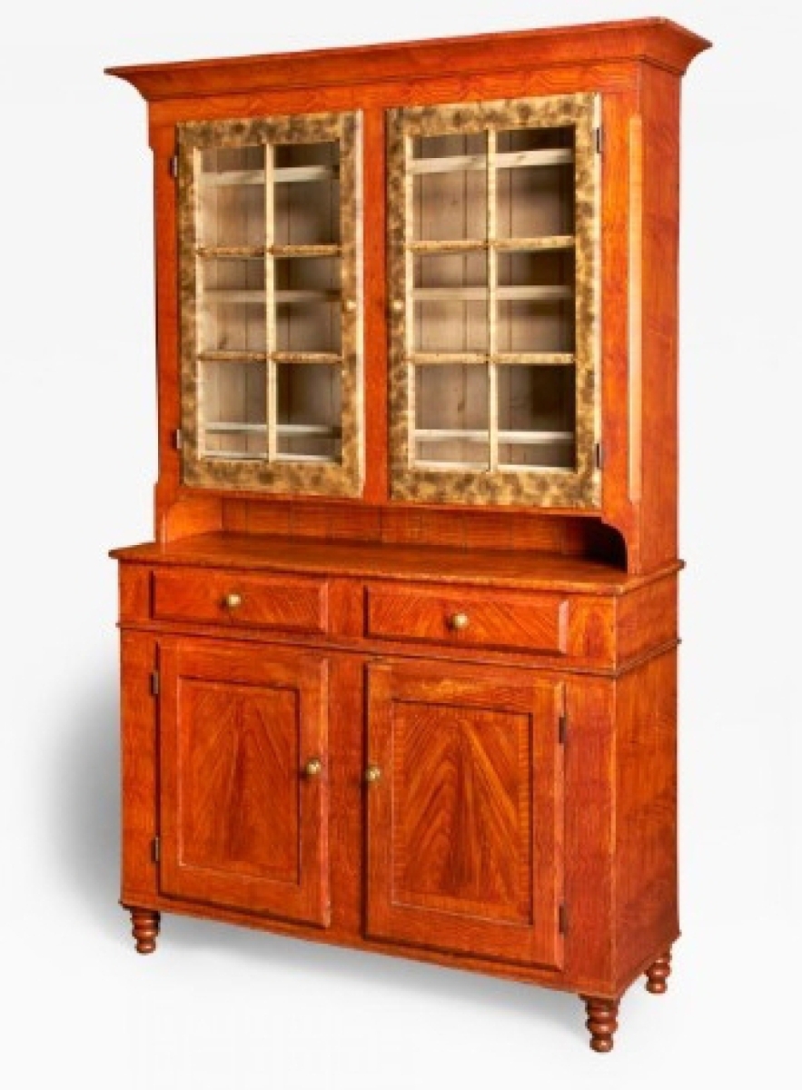 Painted Pennsylvania-made furniture has a long tradition of selling at the Philadelphia Show. Kelly Kinzle got the ball rolling when he sold this paint-decorated stepback cupboard, attributed to Lancaster County, circa 1840s. It retained its original grained decoration and cream paint on the interior. New Oxford, Penn.