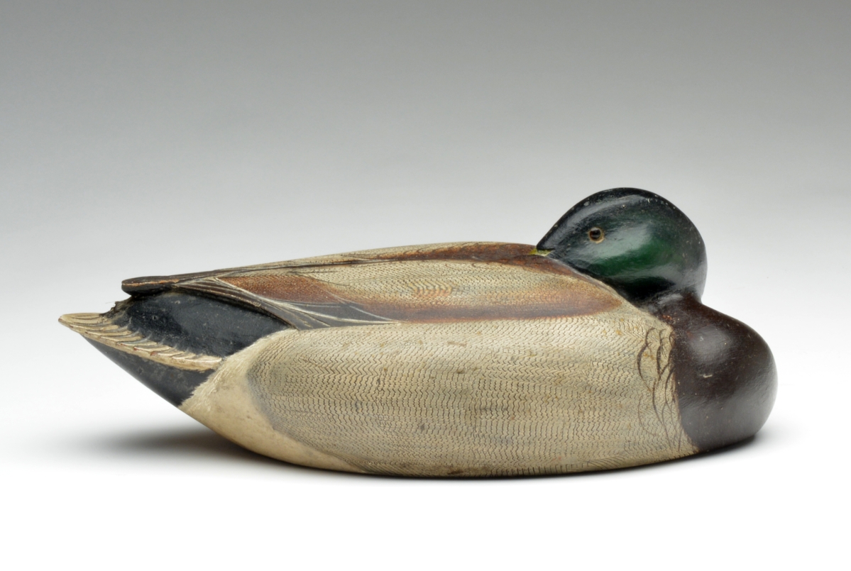 Described in catalog notes as “anatomically more accurate than any working decoy we have ever seen,” this working mallard drake in a tucked head resting pose by Ferdinand Homme, Stoughton, Wis., circa 1930, crossed the block at $81,000.