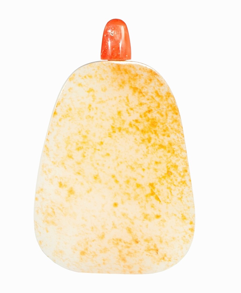 The first of three Chinese snuff bottles to bring $5,625, the top price in the sale, was this white jade partial pebble example with polished russet skin and coral stopper. It went to an online bidder ($300/600).