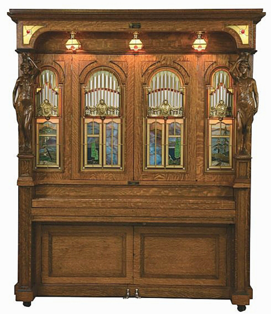 The top lot of the sale was this Style H orchestrion by the J.P. Seeburg Piano Company, which sold for $83,025. It was one of the largest models the company made and one of the most ornate. This example features stained glass and carved figures of Beauty and Strength to the columns, all housed within a tiger-striped oak cabinet. The orchestrion played at the Crystal Saloon in Virginia City, Nevada, for the first half of its life. Seeburg manufactured the orchestrion until the late 1920s.