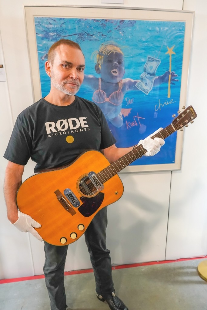 Peter Freedman with Kurt Cobain’s MTV Unplugged guitar sold at Julien’s for $6 million, a new world record. Image courtesy of Julien’s Auctions.