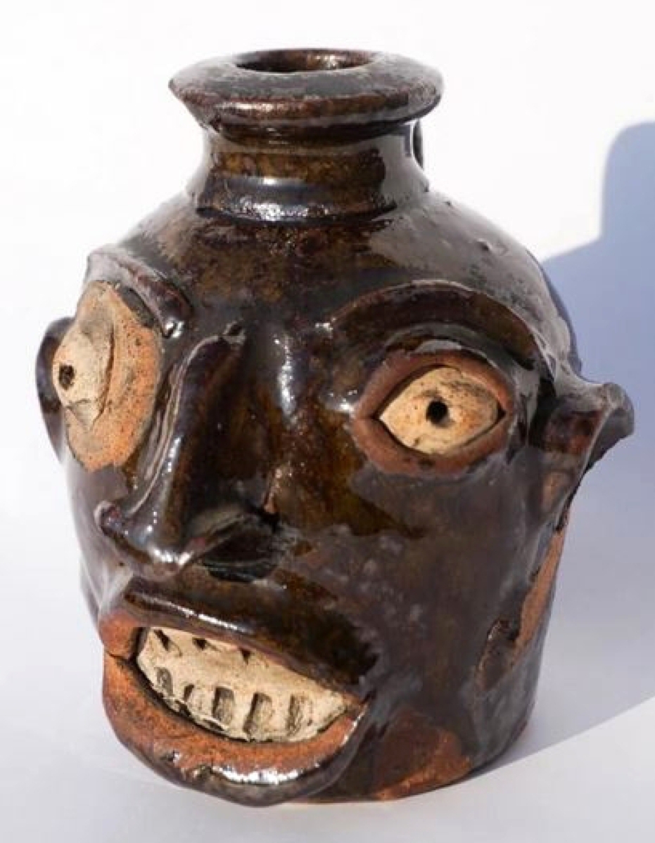 A relatively new collector purchased this 4- -inch Edgefield face jug, the first in their collection. It sold for $22,800.