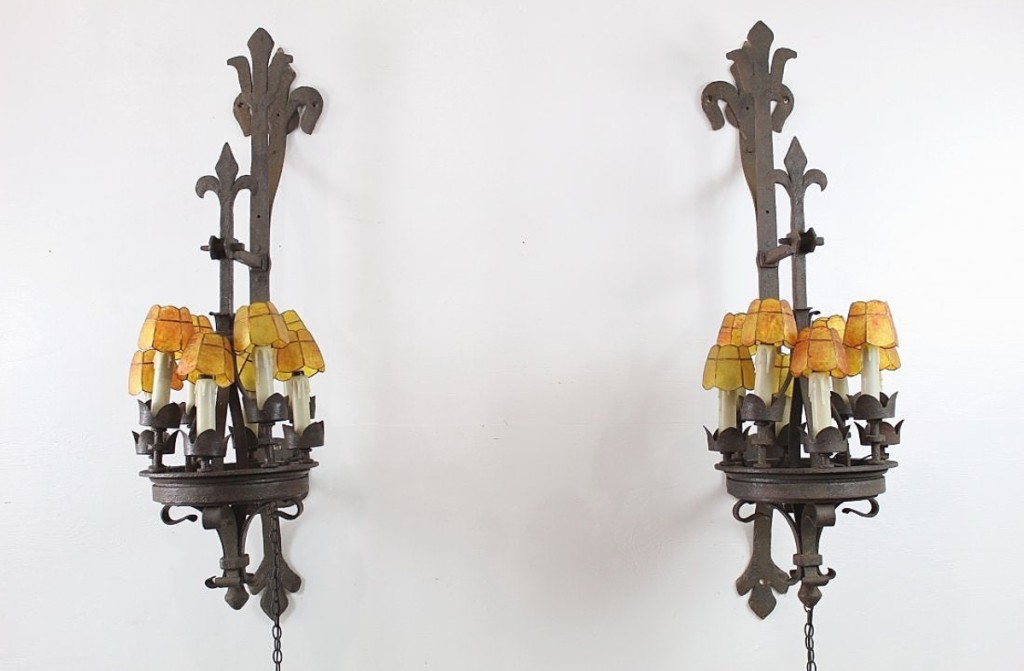 This pair of architectural eight-light iron sconces with mica shades was cataloged as “huge.” Measuring 58 inches tall and 25 inches wide, the pair brought an appropriately large price of $1,783 ($500-$2,000).