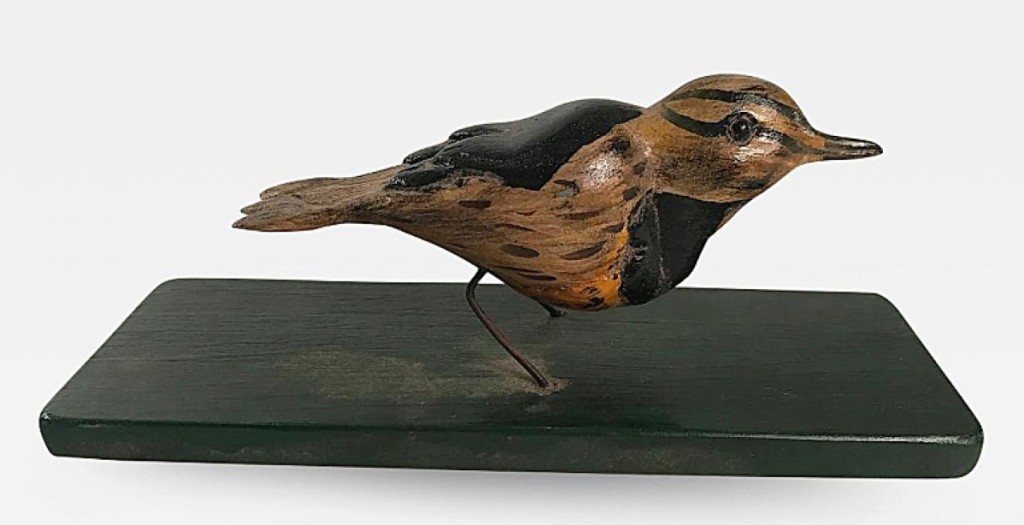 A nice American carved and painted bird, circa 1880, sold at American Spirit, Shawnee, Kan.