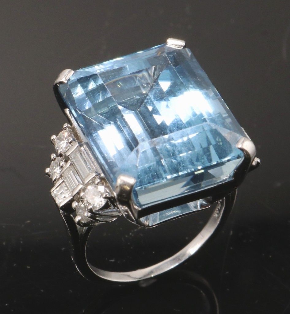 Tiffany and Co. platinum aquamarine diamond ring realized $9,600.