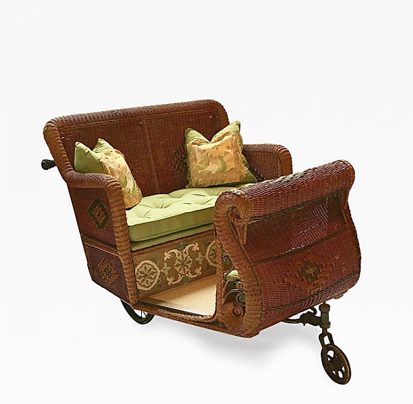 Who needs a ride? Selling from Antique American Wicker, Nashua, N.H., was this wicker estate cart circa 1900-19. It featured a natural finish with colored trim work, stylized diamond designs and bowed Swan front with original wheels.