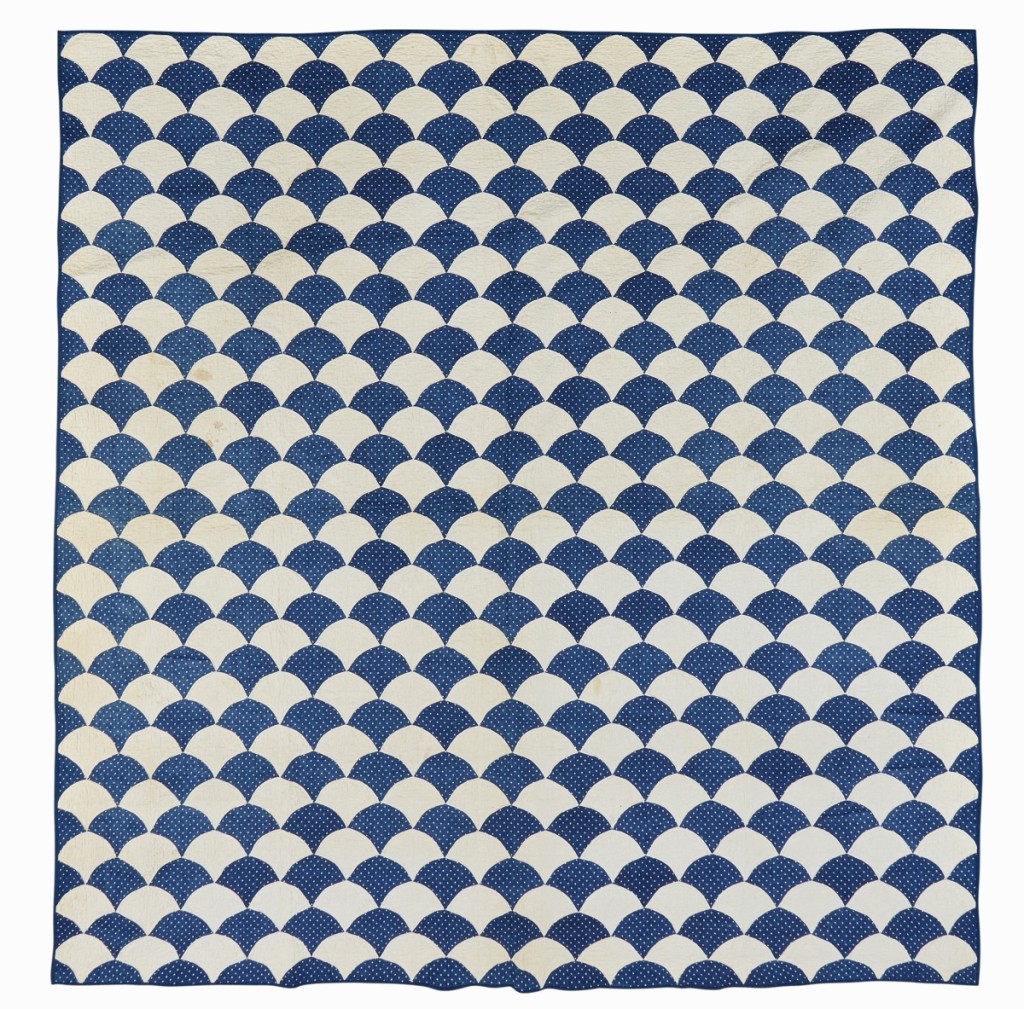 A trade buyer paid $1,000 for a lot of three blue and white printed cotton pieced quilts, all from the last quarter of the Nineteenth Century. In addition to the “Clam Shell” pattern shown here, the lot included a quilt from Ohio in the “Old Tippecanoe” pattern as well a third example in the “Hourglass Chain” pattern ($500/800).