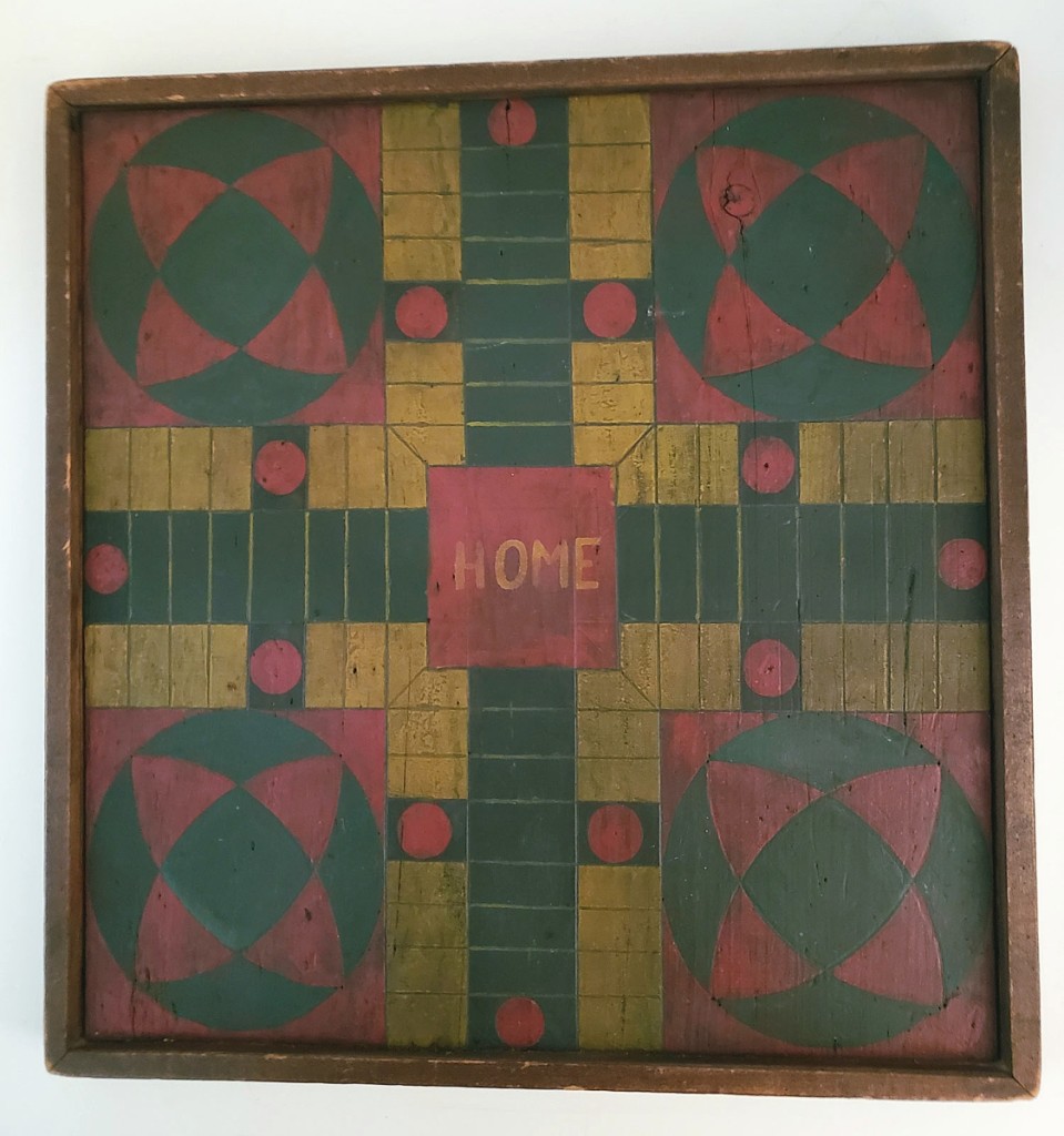 Tom and Beverly Longacre parted with this wooden double-sided game board that had a multicolored Parcheesi game on one side and a red and black checkers game on the reverse. Circa early Twentieth Century, it measured 18 by 17½ inches.