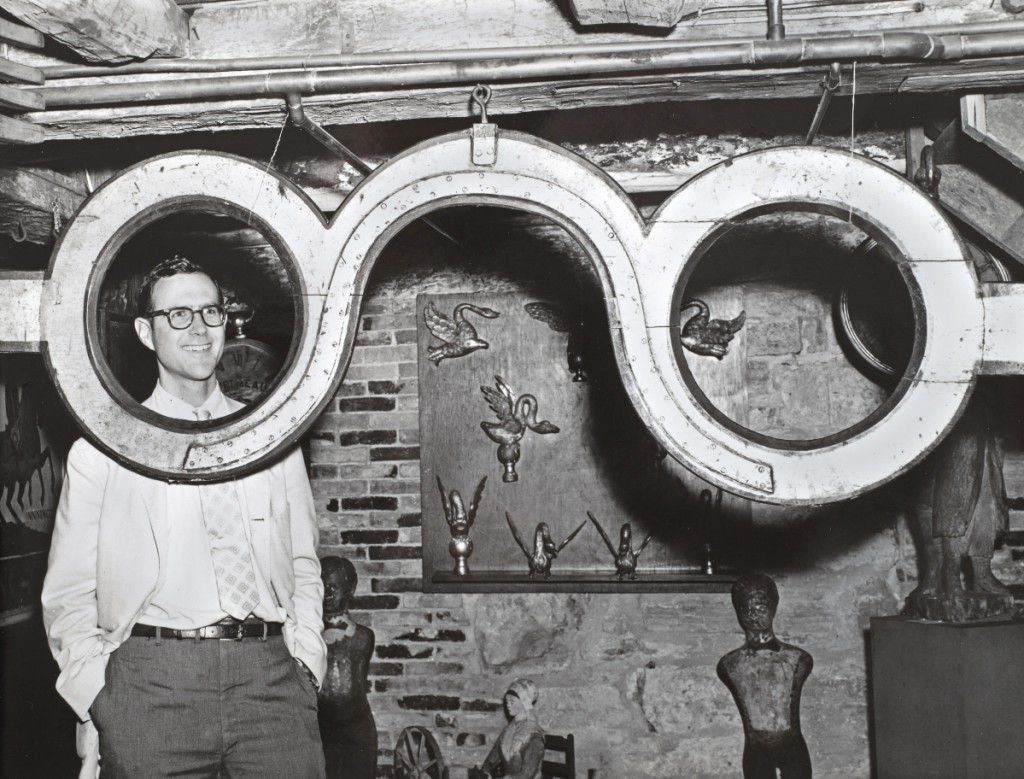 “John Wilmerding with Spectacle trade sign, July 10, 1968” by Einars J. Mengis.   Collection of Shelburne Museum Archives.