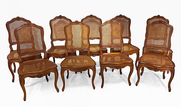 From Roger Winter Ltd, Bucks County, Penn., was this set of nine Louis XV dining chairs from the Eighteenth Century. They had carved beech wood with caned back and seat raised on cabriole legs.