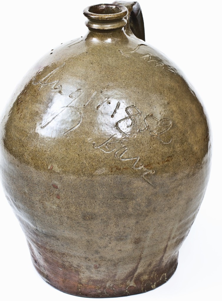 Setting an auction record for its form, this rare 3-gallon alkaline-glazed stoneware jug by the African American enslaved potter Dave from the Edgefield District, S.C., led the summer stoneware auction, selling for $96,000.