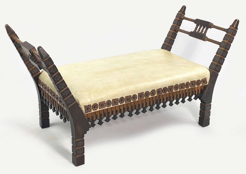 Although they were sold individually, the pair of Bugatti benches totaled $30,700. They were inlaid with geometric pewter designs, copper rosettes, with copper wrapped handles and vellum seats.