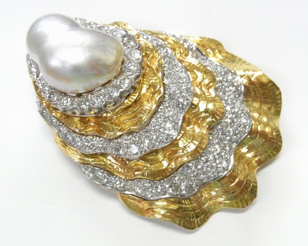 A large David Webb platinum 18K gold South Sea pearl and diamond Oyster Shell brooch clip was bid to $8,856.