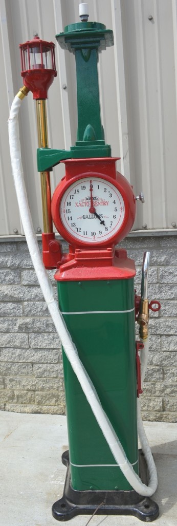Leading a group of professionally restored gas pumps was this Bowser “Pumpkin Head” clock face gas pump with spinner gauge, new white hose and brass nozzle. It elicited a winning bid of $8,400.