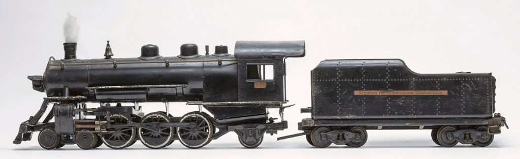 The original owner consigned this pressed steel Buddy L engine and tender, along with six additional cars offered in separate lots. One collector bought them all for a combined $6,592.