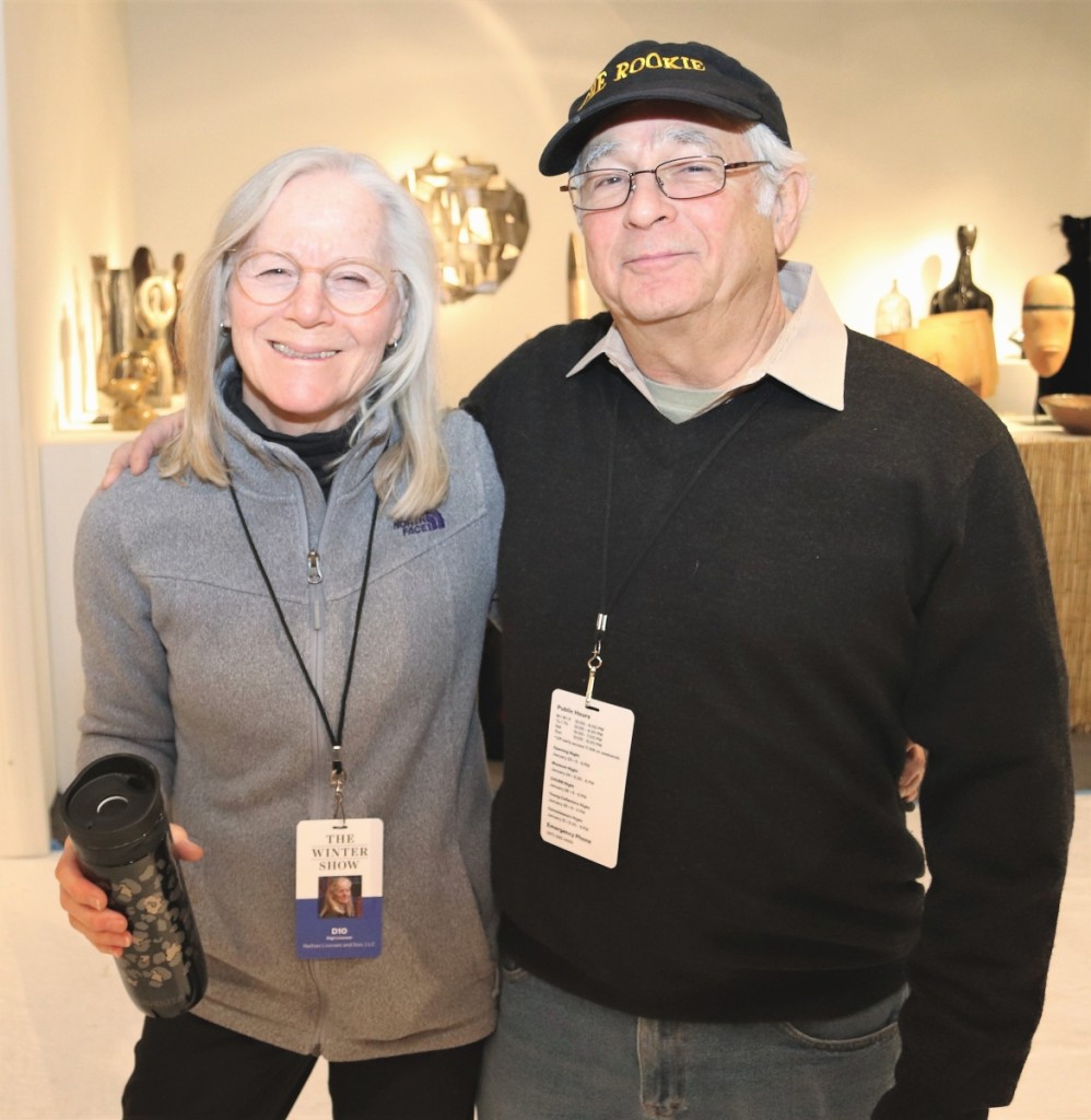 Gigi and Arthur during set up at New York’s Winter Show. Of his “Rookie” cap he has explained, “You never stop learning in this business.”