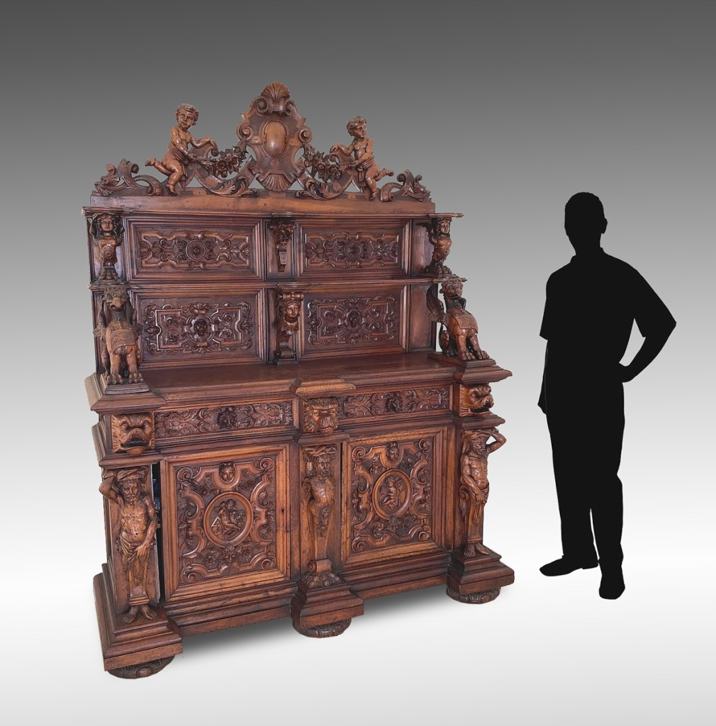 The massive carved walnut stepback huntboard/cabinet was just one of the profusely carved pieces of furniture offered in the sale. Nineteenth Century and in the manner of Luigi Frullini, it realized $3,900.