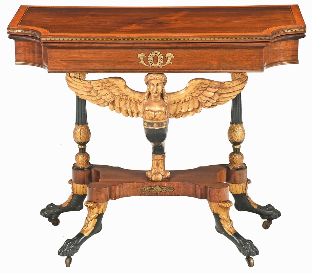 Made of rosewood with gilt and vert antique details, this New York Classical card table with a caryatid support was once attributed to Lannuier. Leading scholars now believe Duncan Phyfe made it around 1815-20. The table, $159,900 ($40/60,000), descended in the Ravenel, Frost and Pringle families of Charleston, S.C., and most closely resembles a pair of Phyfe-attributed card tables from the Westervelt-Warner collection auctioned by Christie’s in 2013 for $255,000.