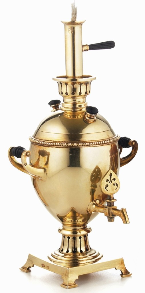 Formerly in the Forbes Collection, this table lighter in the form of a miniature samovar was made by Fabergé under the direction of workmaster Anders Nevalainen, St Petersburg, 1896-1908. Gilded-silver with ebony handles and knobs, height 4¾ inches. A La Vieille Russie.