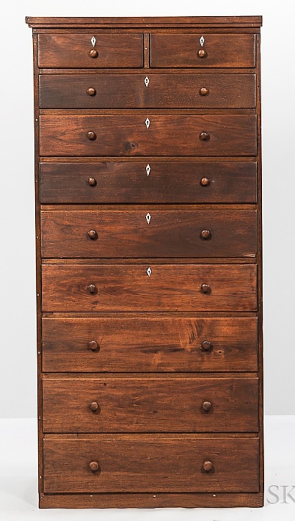 This built in butternut chest of ten drawers sold for $5,938. It was originally made for the trustee’s house at the Enfield, N.H., community. The top drawers featured diamond ivory keyhole escutcheons.