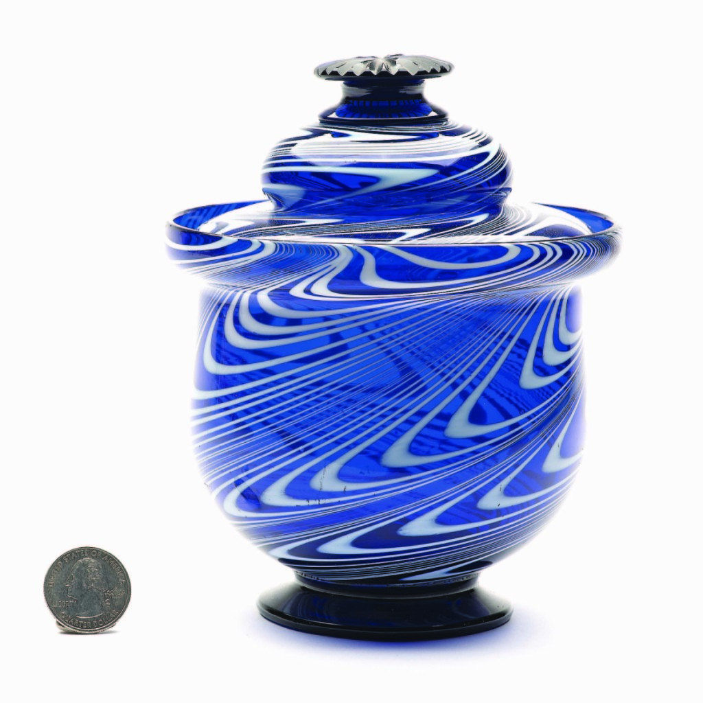 Displaying the trifecta of form, origin and color, this free-blown covered sugar bowl, probably American Midwest, 1840-60, fetched $5,558.