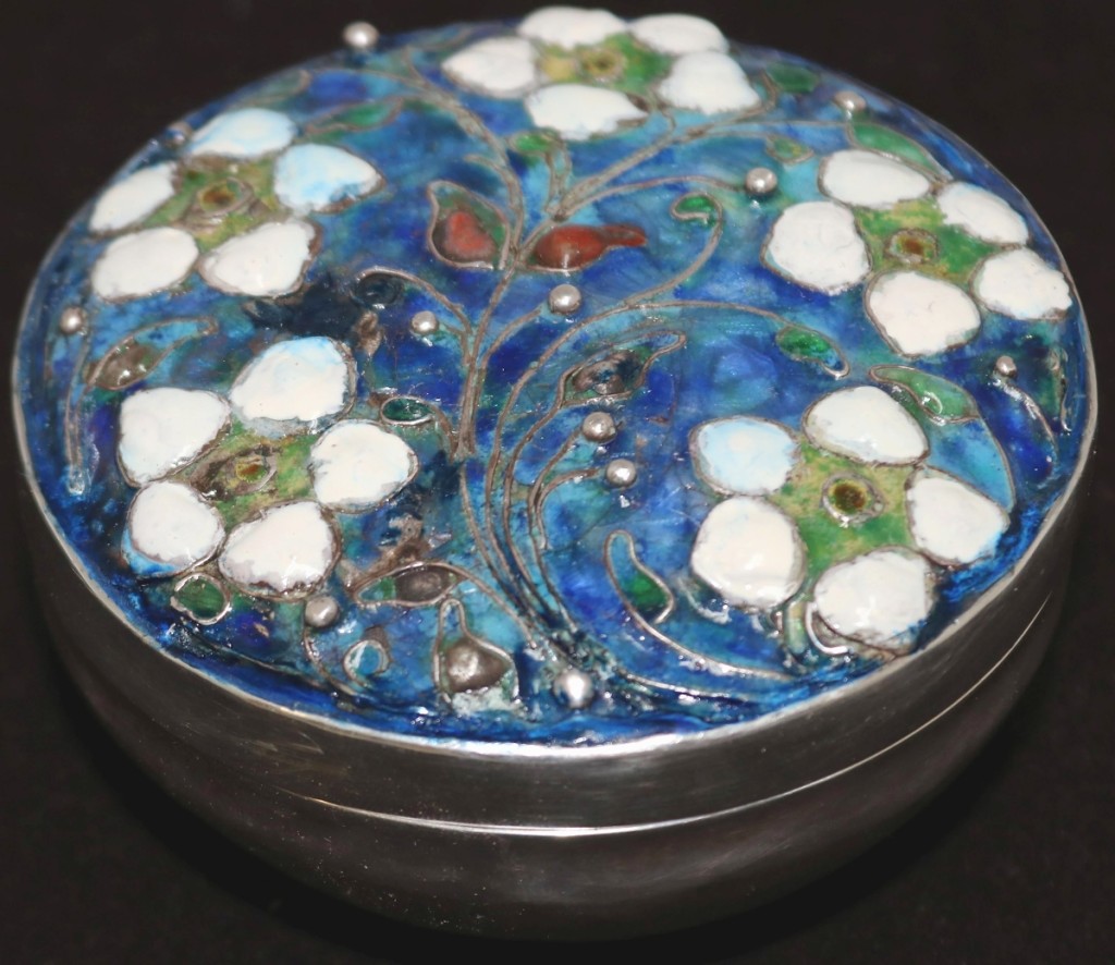 This hammered silver and enameled box was signed and dated EC 1910. With bright colors and a floral pattern, it turned out to be one of the surprises of the day, earning $9,360.