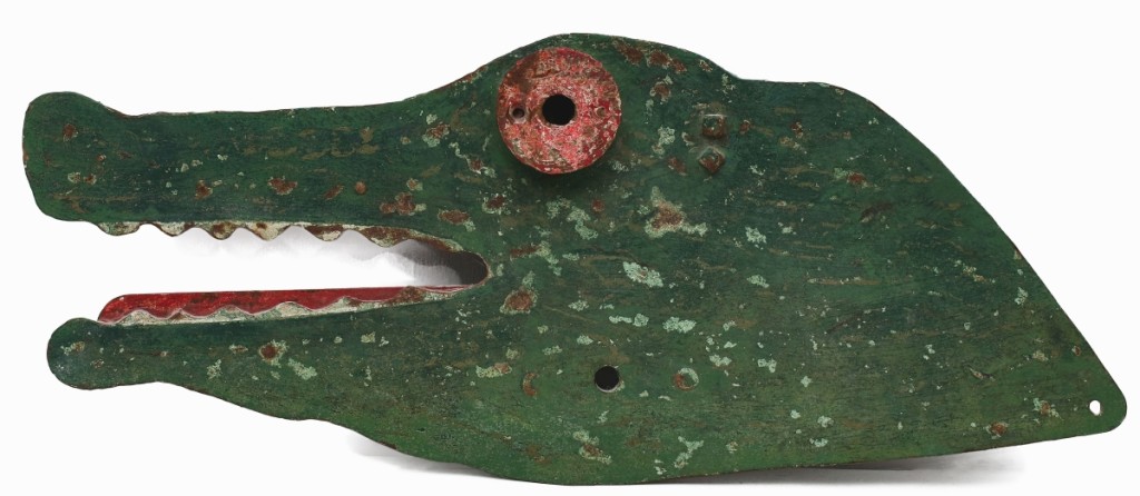 The Tuckers found this iron crocodile target, the only example known from Mangels, in a New Hampshire barn. He pulled the third highest result of the sale at $23,600. The target measured 33 inches long with applied bull’s-eye for an eye and the original iron gong to the back.