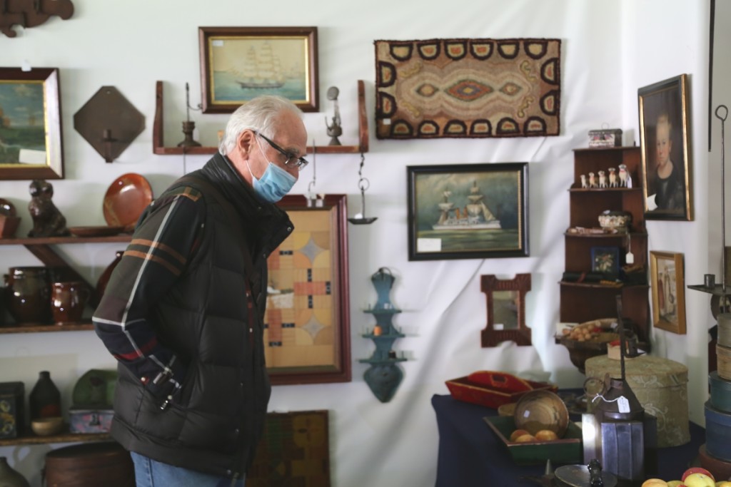 Dealer Rich Garthoeffner was not selling, but he was caught perusing the show as a buyer. —Antiques At Fletcher Fields