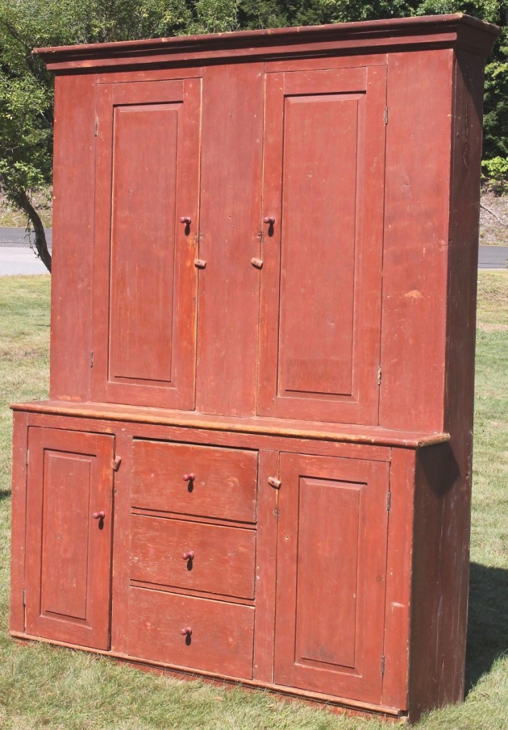 This red-painted Eighteenth Century stepback cupboard was originally a built-in and had later backboards. Reuling said it was “a really great thing,” and noted that the buyer was a young woman who had recently purchased a house in the Westmoreland area; she had been bidding on the phone and paid $2,160 for it ($1,5/2,500).